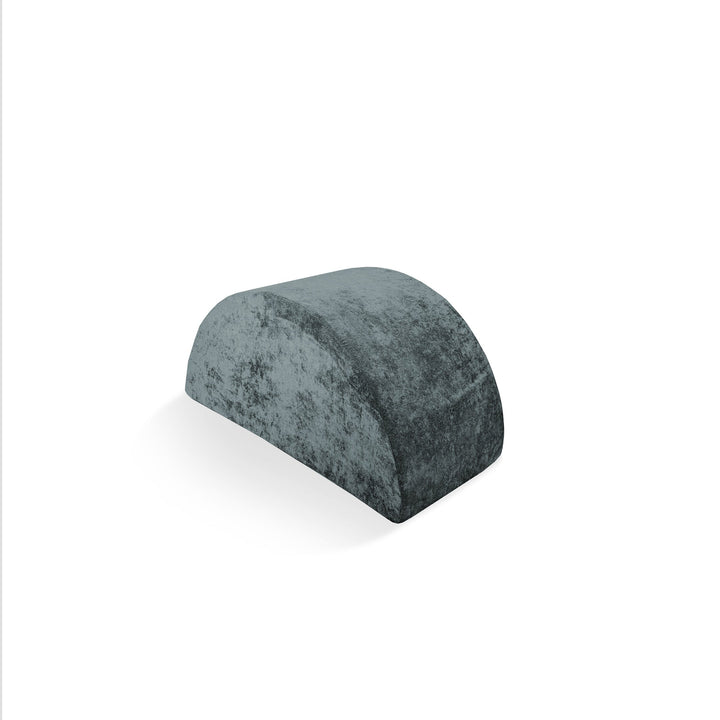 A gray Mega Rocker, a semi-circular foam play accessory with a textured surface, designed to be used with a Coconut Play Couch.