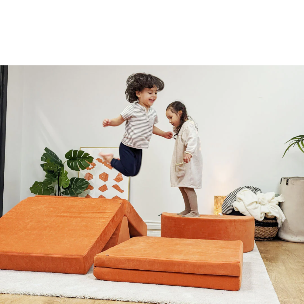 Two Kids Playing On A Orange Modular Play Clouch