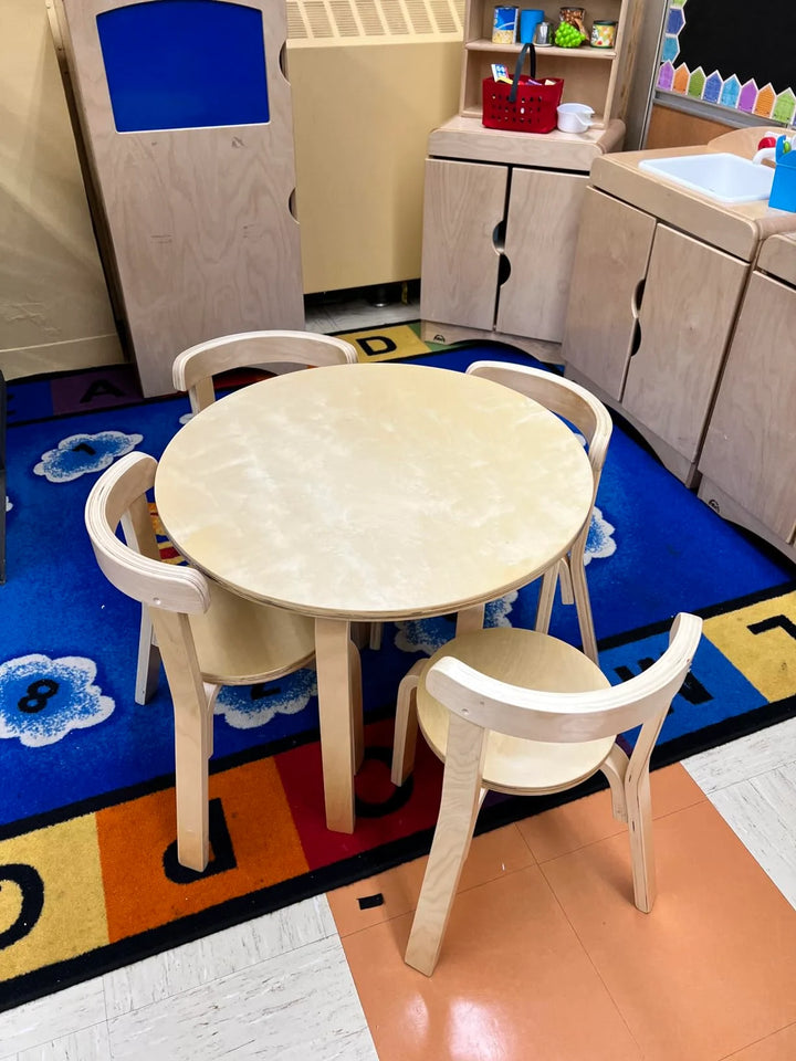 Desk And Four Chairs Set In A Daycare