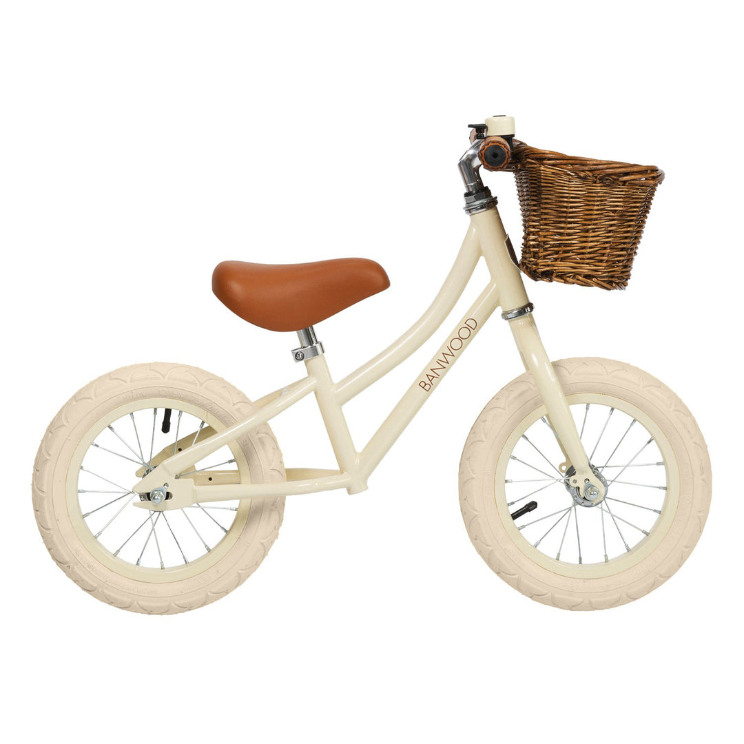 Banwood First Go balance bike in Cream with wicker basket