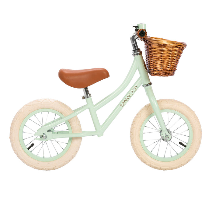 Banwood First Go balance bike in Pale Mint with wicker basket