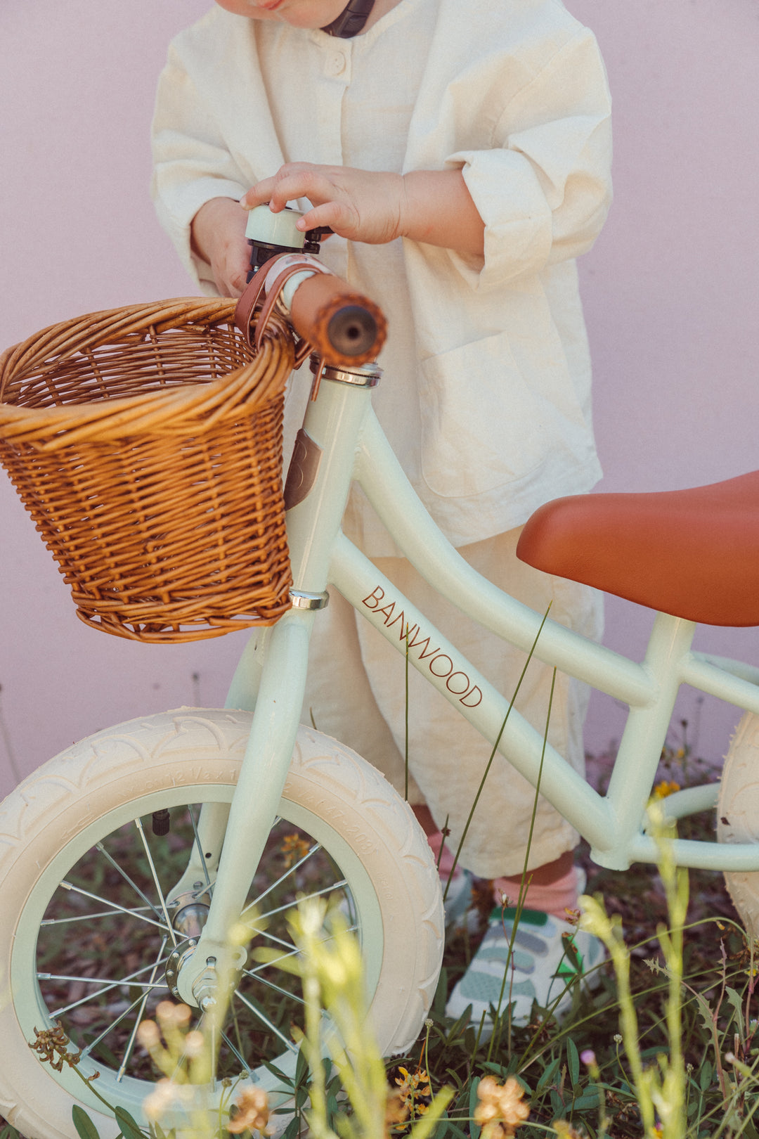 Banwood First Go balance bike wicker basket and leather grips in use