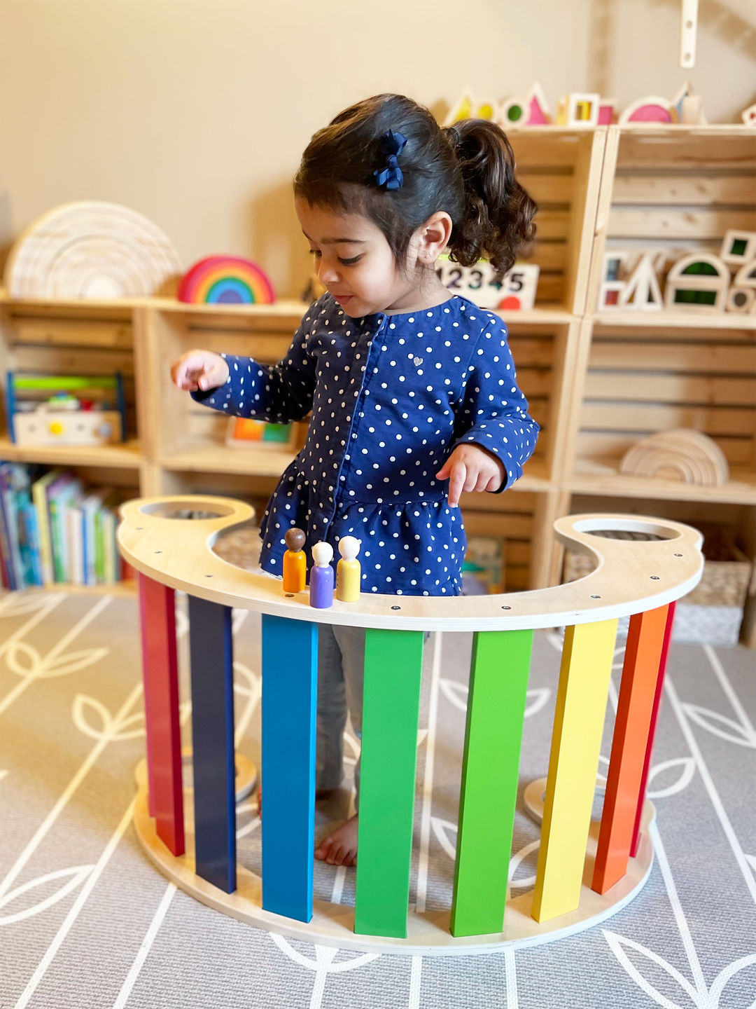 Kids Playing With A Rocker Arch