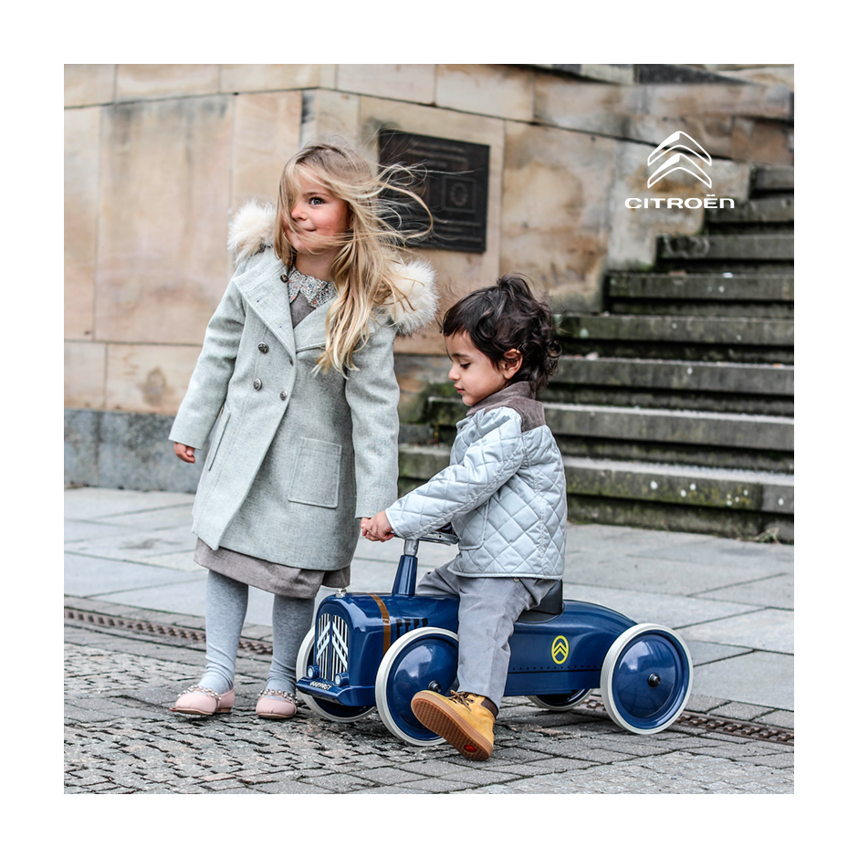 Two children with the Baghera La Petite Rosalie ride-on