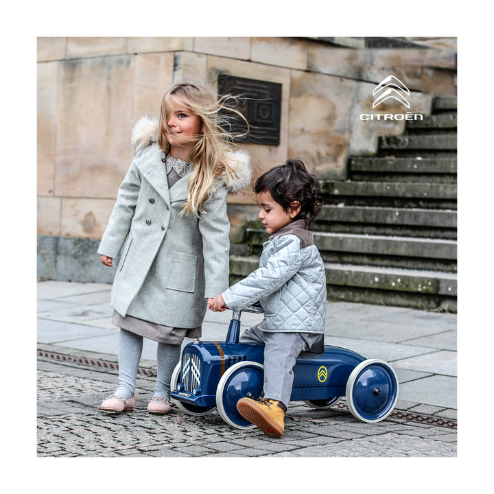 Two children with the Baghera La Petite Rosalie ride-on