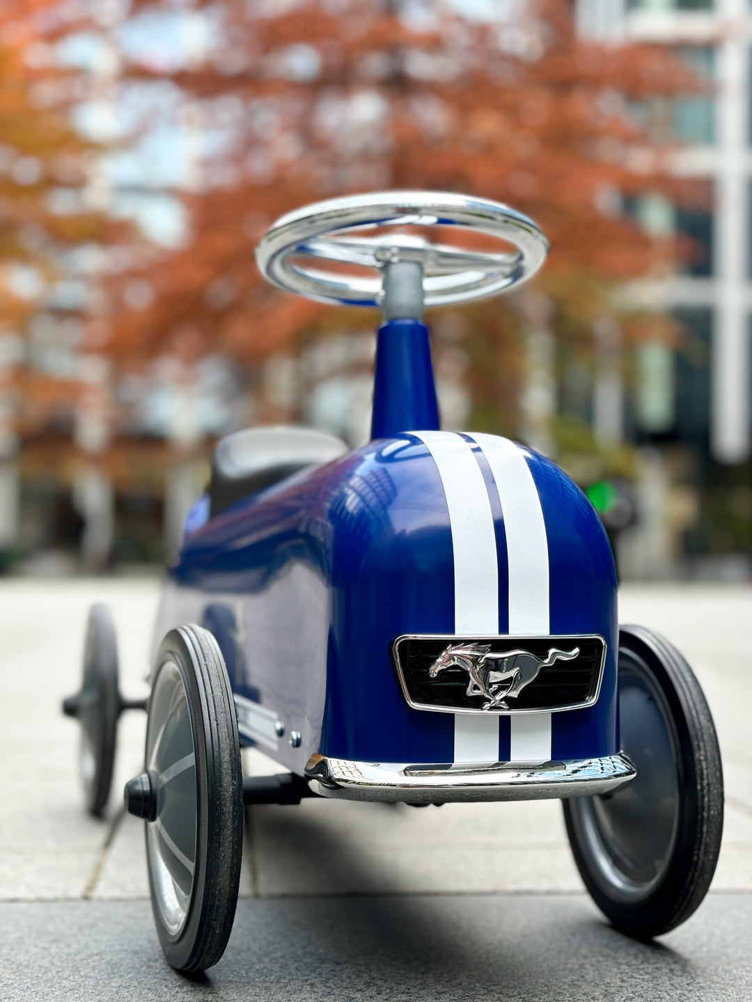 Baghera Ford Mustang ride-on car on a city street