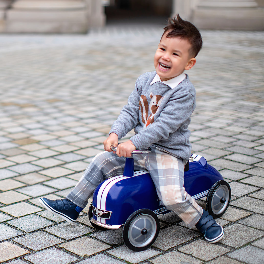 Toddler driving the Baghera Ford Mustang ride-on car