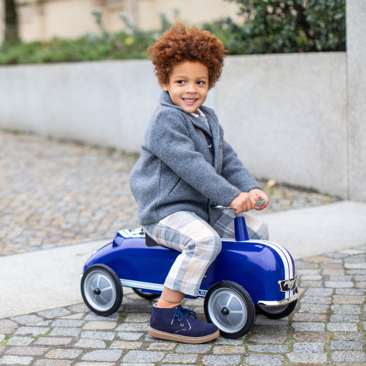 Little driver on the Baghera Ford Mustang ride-on car