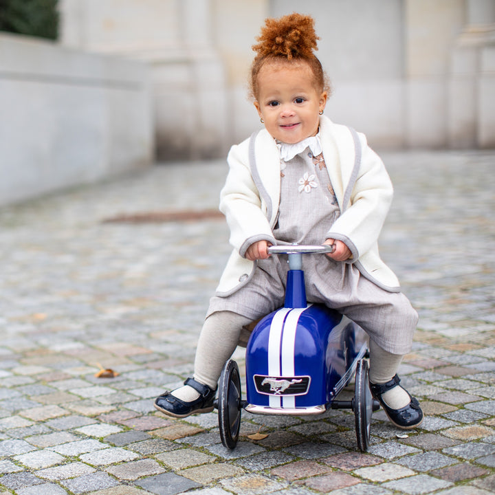 Toddler on the blue Baghera Mustang ride-on