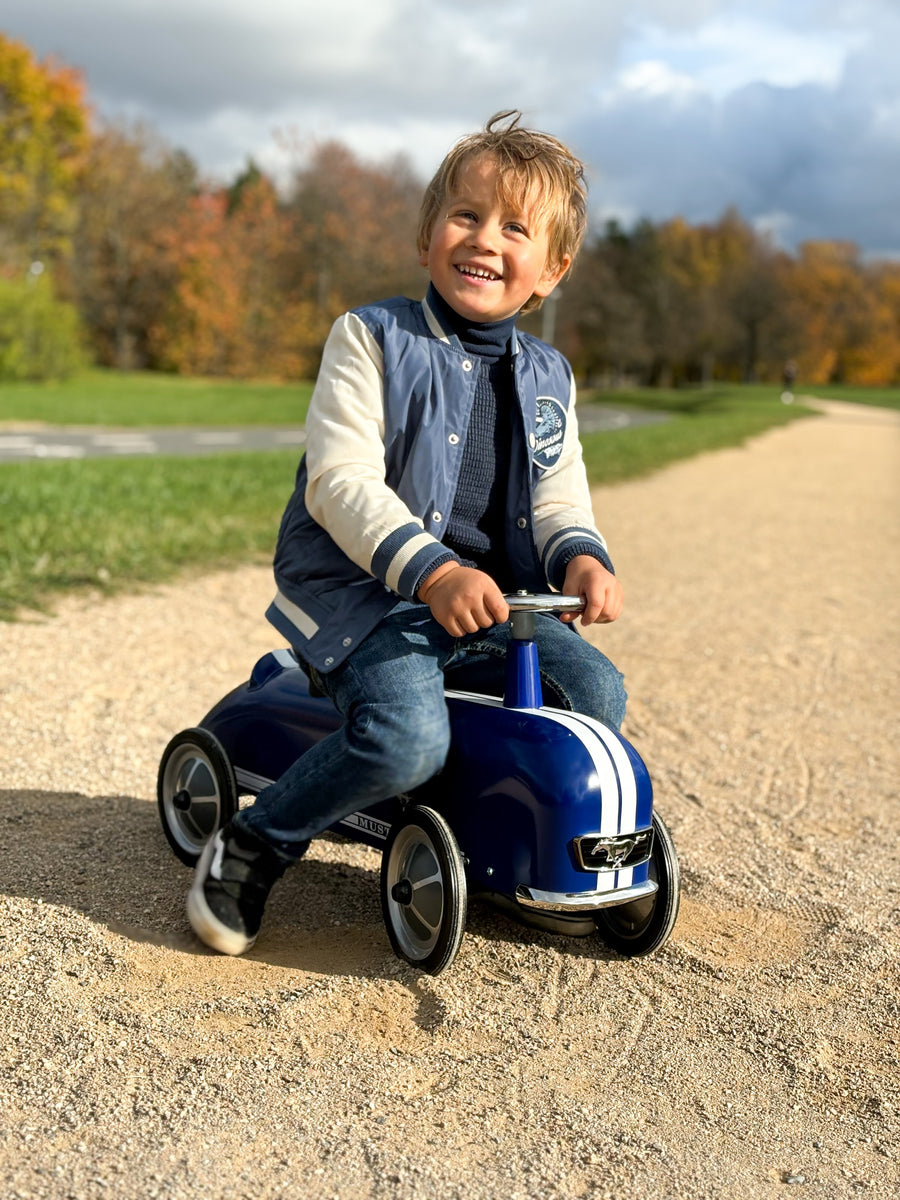 Child riding the Baghera Ford Mustang in the park