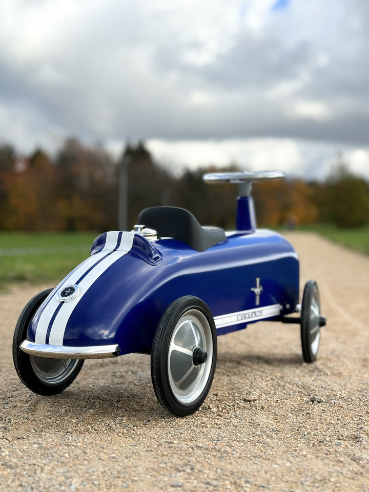 Baghera Ford Mustang ride-on car parked outdoors