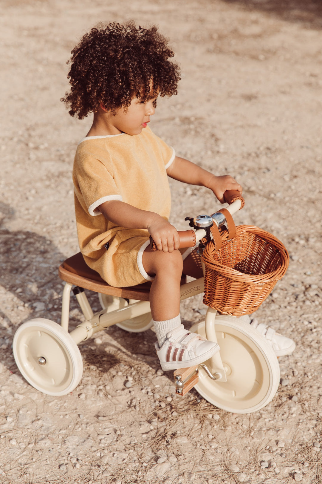 Toddler on the Banwood Vintage Trike with wicker basket