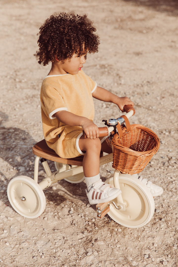 Toddler on the Banwood Vintage Trike with wicker basket