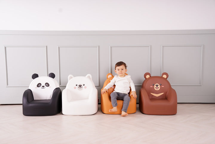 Toddler on the Dwinguler Grizzly Bear kids sofa next to the other Bear Friends