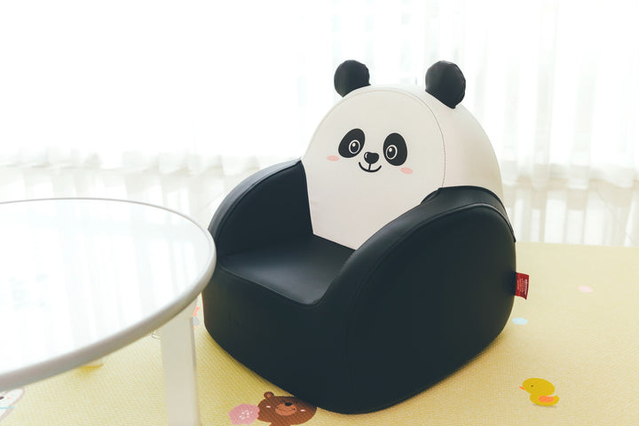 Dwinguler Panda Bear kids sofa beside a play table