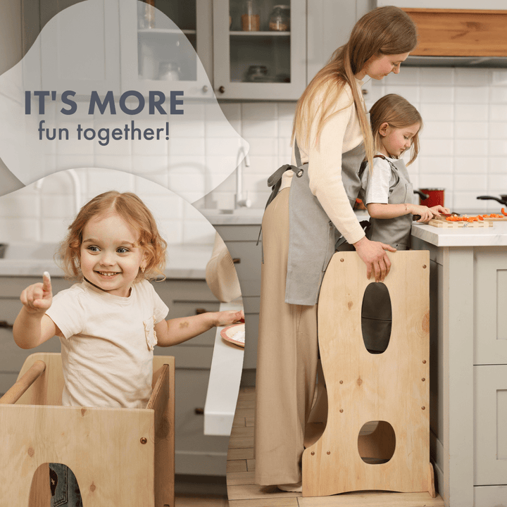 Woman and two children playing with wooden furniture in a kitchen.