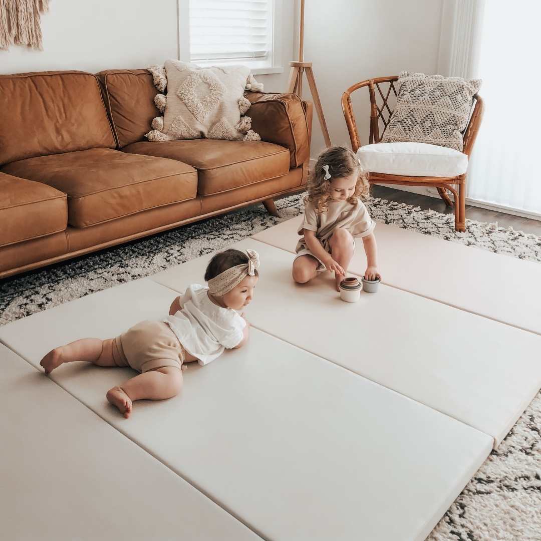 kids playing on a non toxic playmat